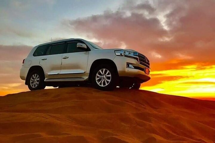 Experience the vast beauty of Dubai’s red sand dunes blending high-speed ATV adventures with serene camel rides all framed by stunning desert sunsets and rich cultural traditions.